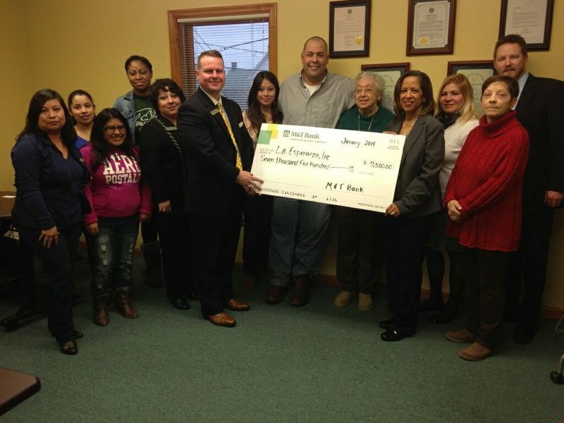 At the donation of the M&T Bank grant to La Esperanza are (l-r) Maria Porras, Family Development Program coordinator; Monserrat Celayos, victim advocate; Amy Perez, receptionist; Nyisha Williams, PASA program manager; Maria Torres, relationship banker, M&T Bank; Robert Bunting, team leader Business Banking, M&T Bank; Mayra Cruz Reyes, victims immigration assistant; Jesus Santana, mental health therapist; Sister Ascension Banegas; Claudia Peña Porretti, executive director; Marilyn Veguilla, teller, M&T Bank; Trish Herholdt, bookkeeper; and Steve Loughren Sr., branch manager, M&T Bank. SOURCE SUBMITTED